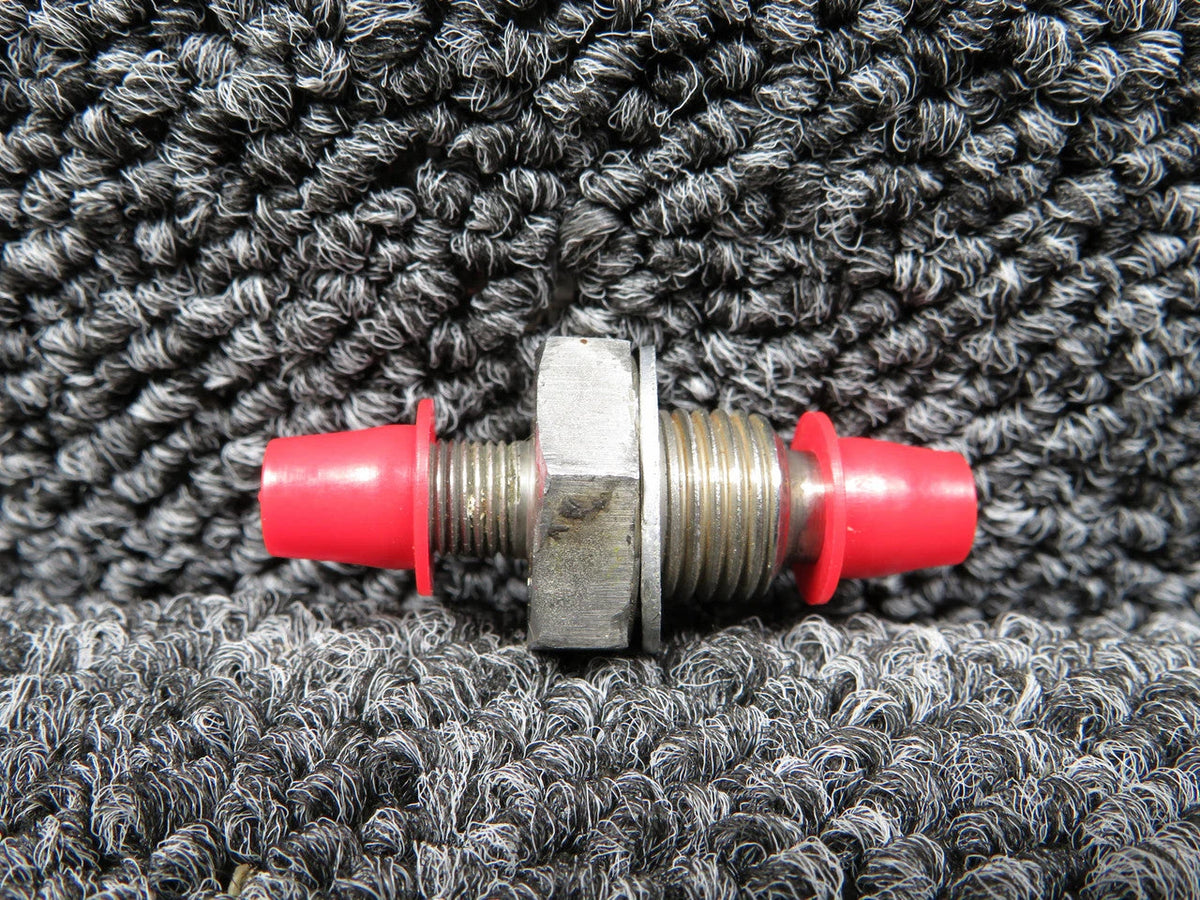 Schrader air bleed valve AN812-1, featuring metal body and red plastic caps for easy air release.