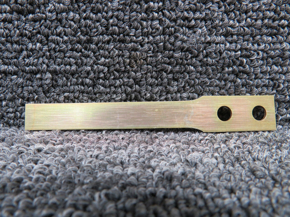 25UM1277 Door Uplock Spring with 8130-3, New Old Stock, metallic finish, dual holes for installation.