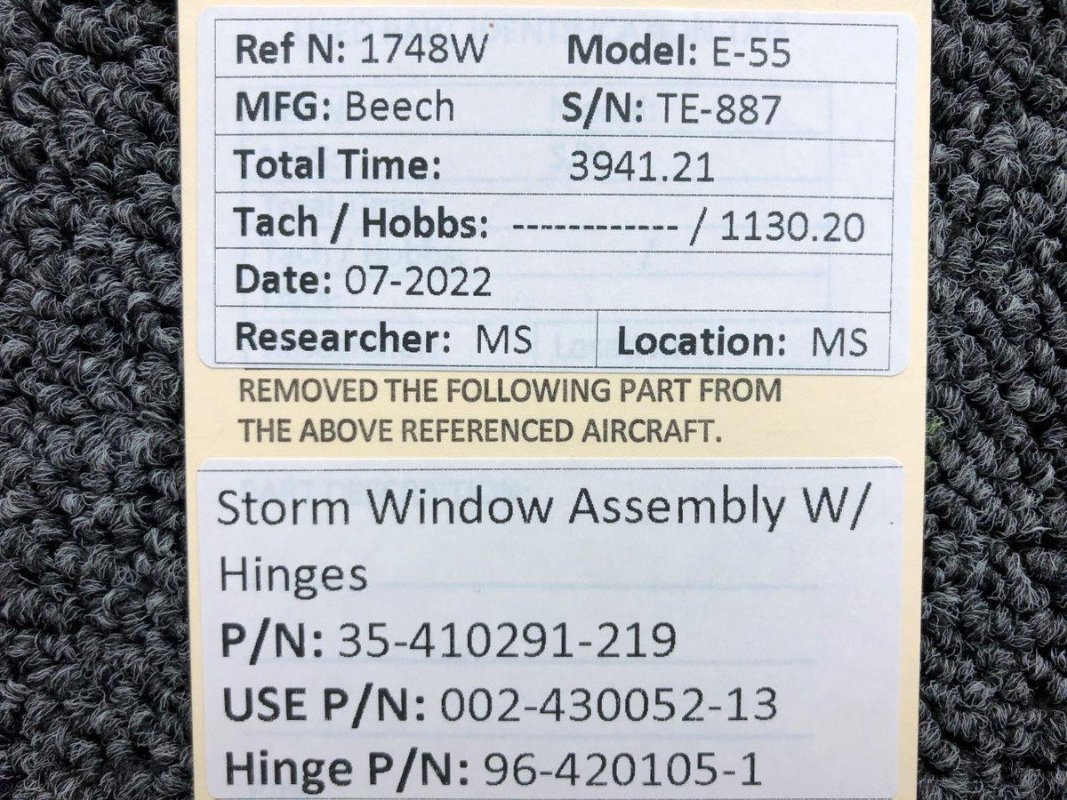 35-410291-219 (USE: 002-430052-13) Beechcraft E-55 Storm Window AssY W/ Hinges BAS Part Sales | Airplane Parts