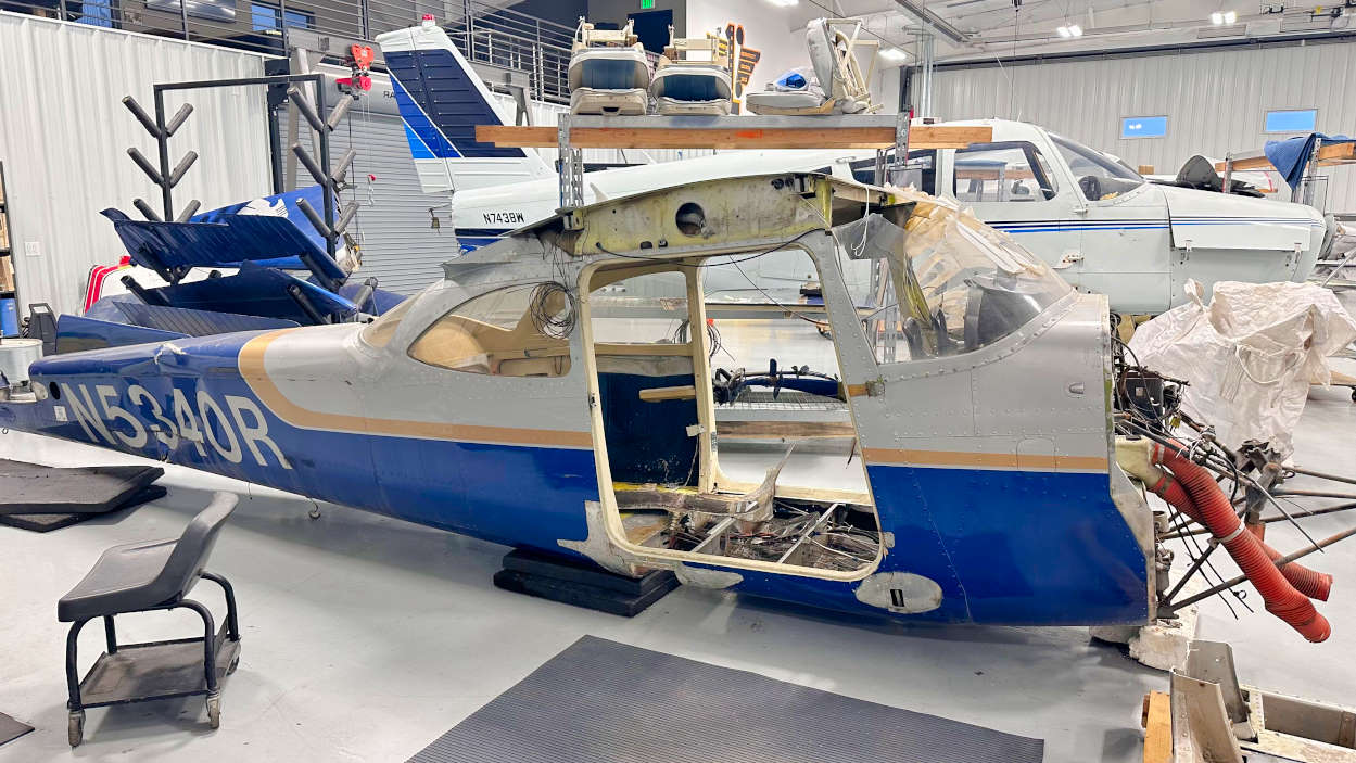 Wrecked Cessna 172F stripped to the fuselage in the BAS aircraft salvage hangar