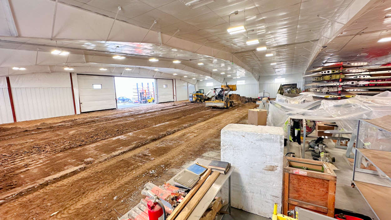 Crews remove old asphalt and concrete to make room for the new hangar floor at BAS Part Sales