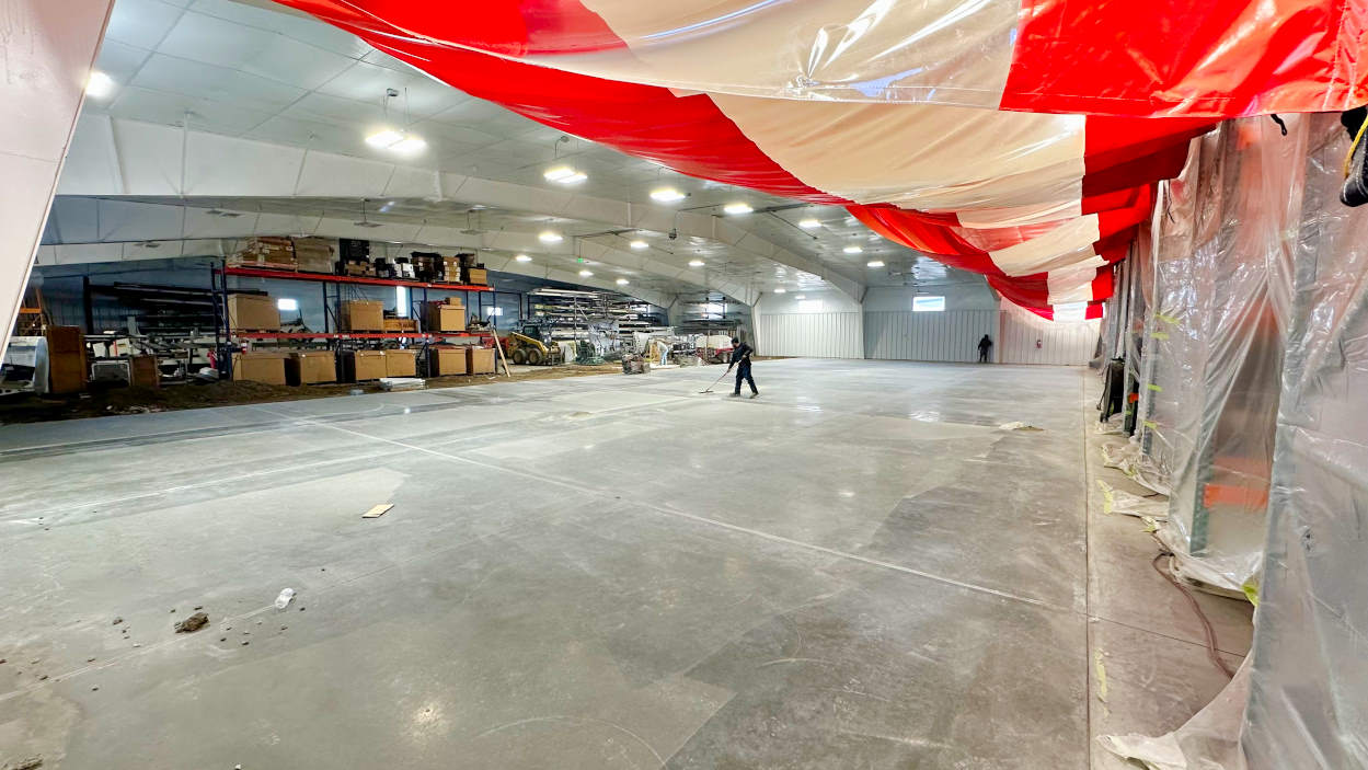 Fresh concrete in the new 13,000 square foot airplane hangar addition