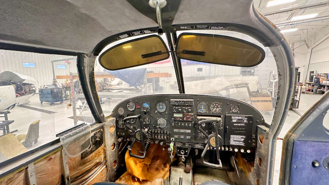 Piper PA28 Cherokee cockpit and instrument panels in the aircraft salvage hangar